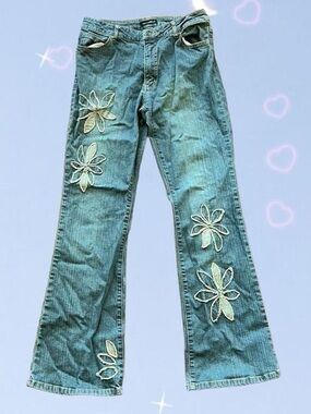 Distressed floral denim jeans